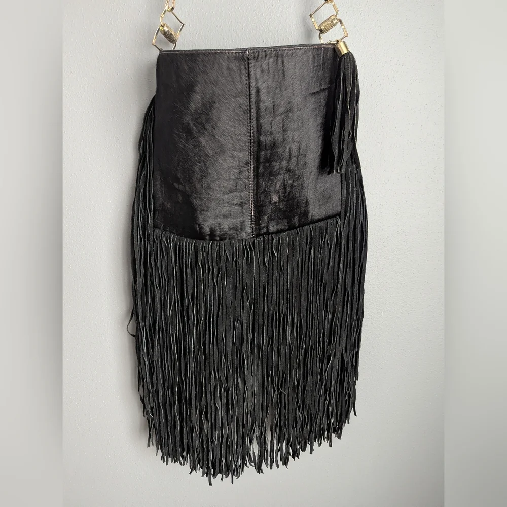 Black leather Fringe crossbody bag feels like cow leather. No tags. No brand tag
